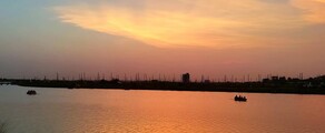 Location de Jet Privé – Coucher de soleil sur un lac.