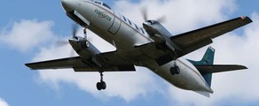 location jet privé: METRO III en vol, ciel partiellement nuageux.