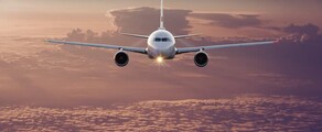 Location de jet privé Airbus A340 au coucher du soleil.