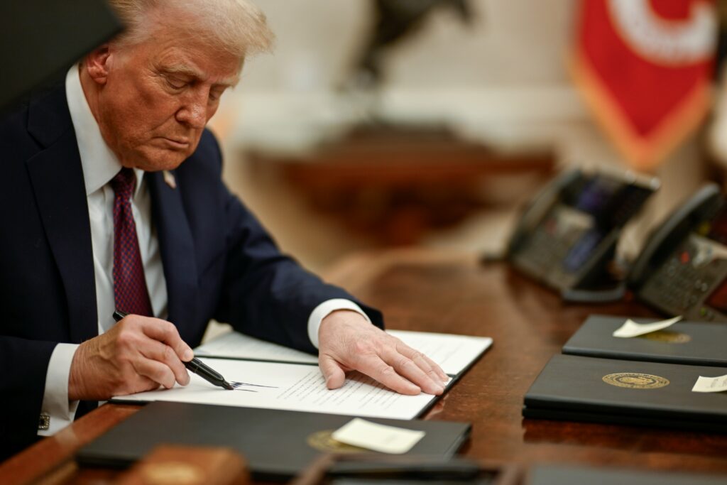President Donald Trump signing